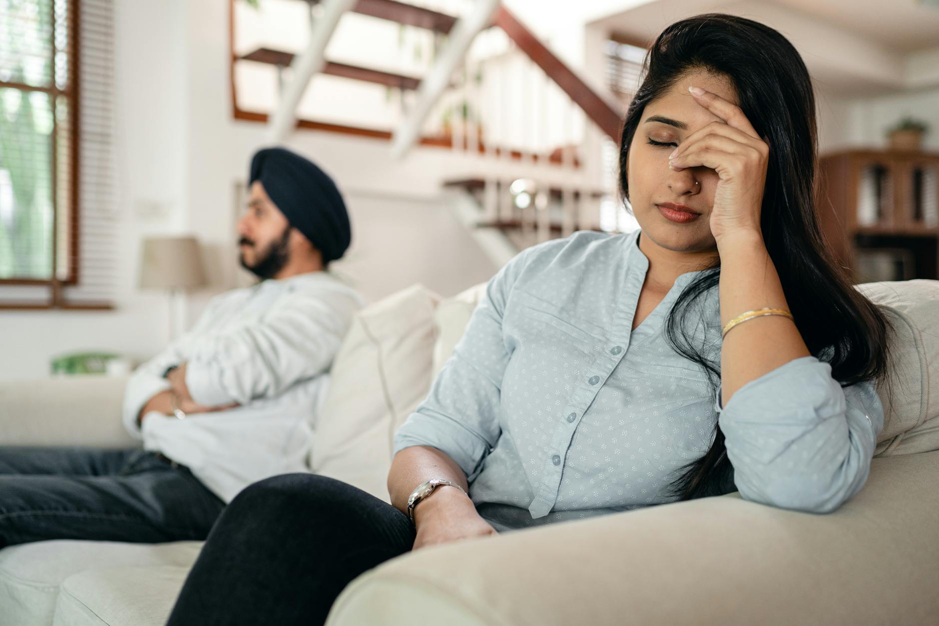 upset young indian couple after conflict