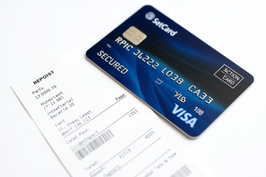 Secured credit card next to deposit receipt