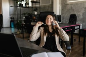 photo of a woman talking on the phone while smiling