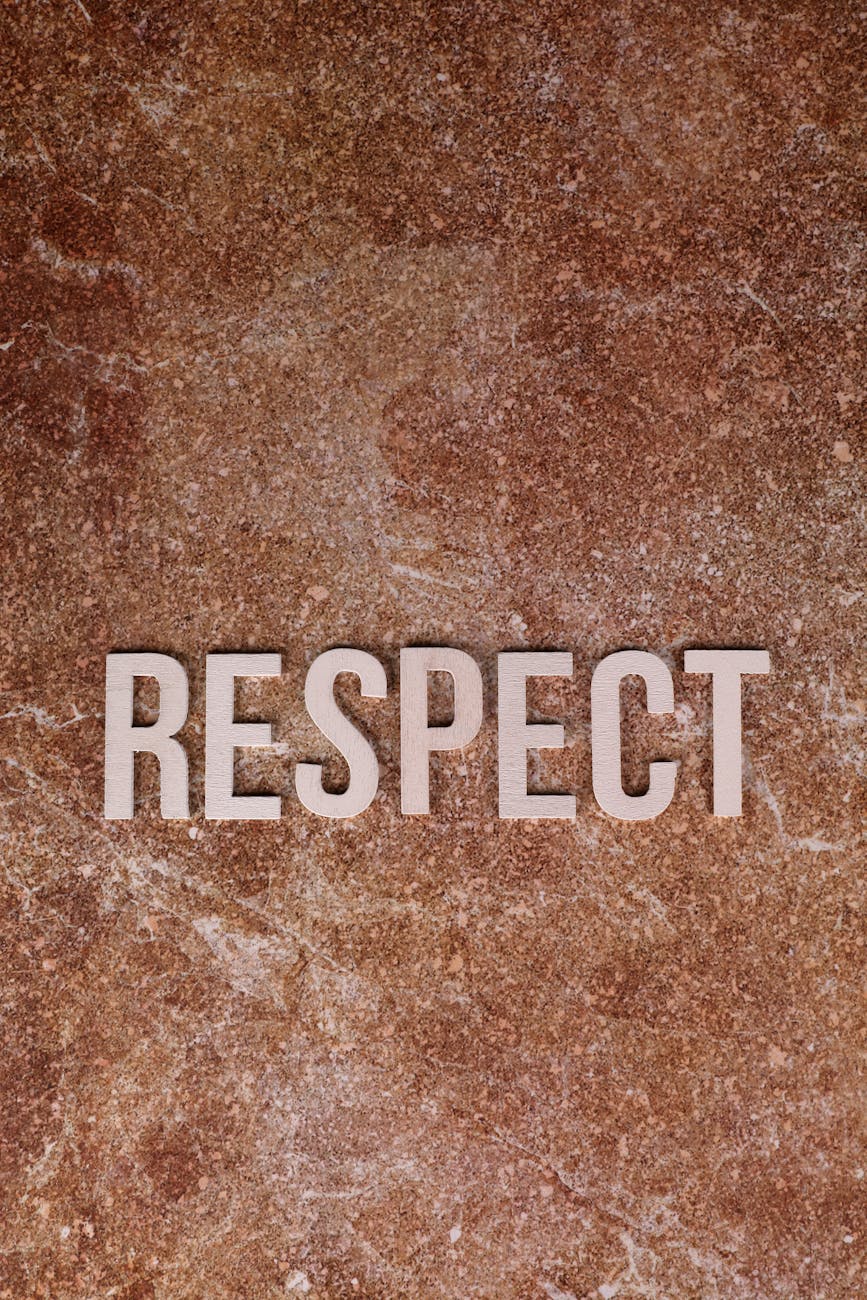 respect text on brown marble background