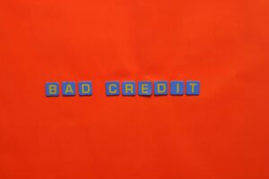 a bad credit text on red surface